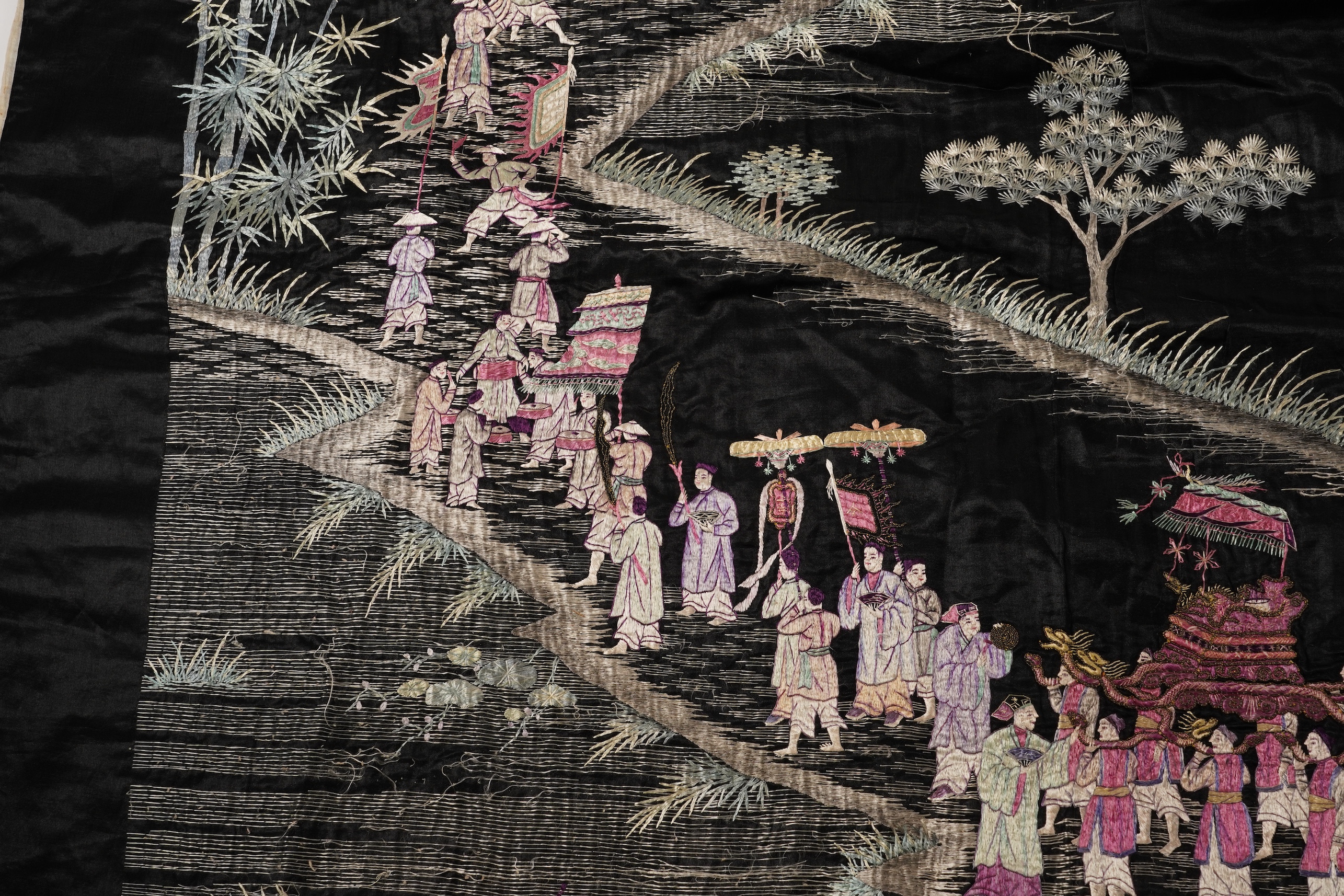 Four Chinese embroidered silk panels, late 19th/early 20th century and a similar Indian panel